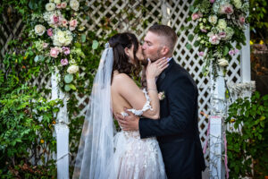 A bride and groom kissing after becoming newly weds in Santa Clarita, California.