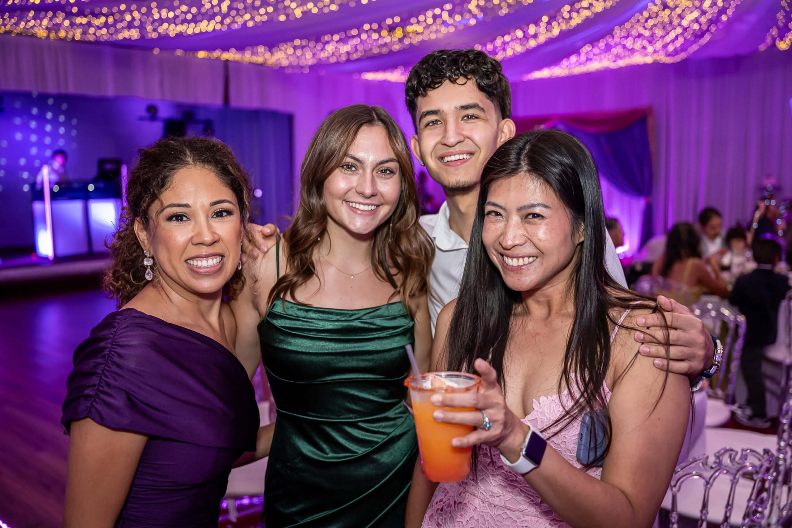 Group photo with people smiling during event.