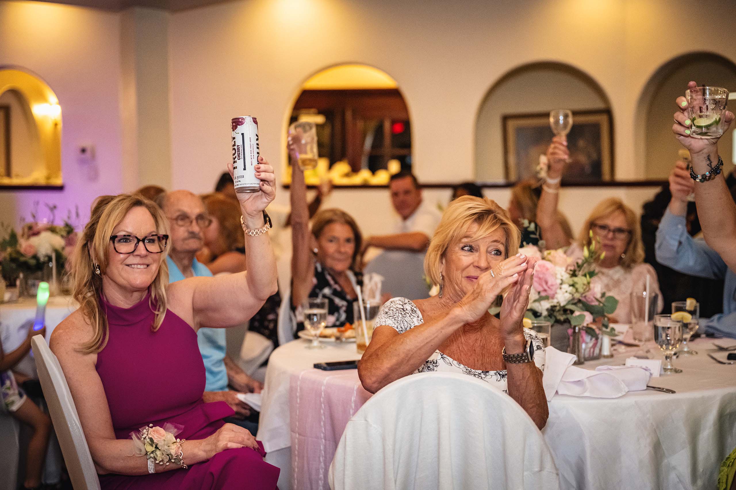 People doing a toast at a wedding.
