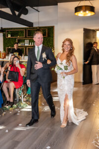 Father walking bride down the aisle in Los Angeles, California.