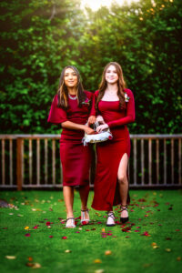 Two bridesmaids approach the alter in Ventura, California.