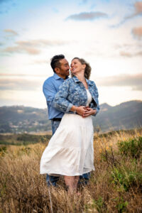 A couple embraces one another as they prepare to get married in Ventura, California.