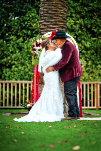 Bride and groom embrace one another during their ceremony in Ventura, California.
