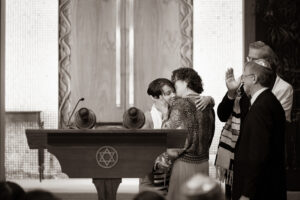 A mother embracing her son as he completes his Bar Mitzvah in Santa Barbara, California.