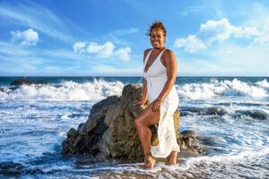 A woman poses on the ocean in Malibu, California. 